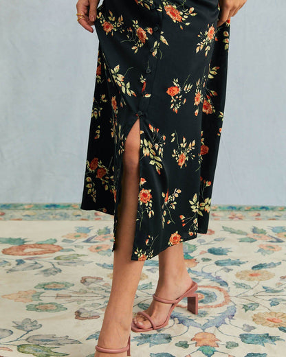 Jenni - Abito nero con scollo a V e stampa floreale
